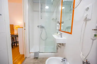 Un baño de Apartamentos Huertas