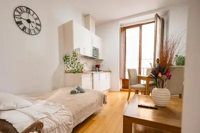 Cama o camas de una habitación en Apartamentos Huertas