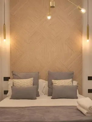 Cama o camas de una habitación en SUITES YOU Soho