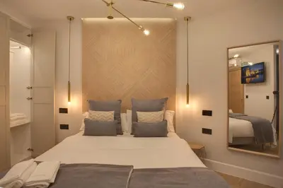 Cama o camas de una habitación en SUITES YOU Soho