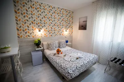 Cama o camas de una habitación en Bloom Inn Madrid
