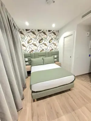 Cama o camas de una habitación en Hostal San Blas