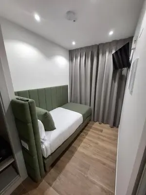 Cama o camas de una habitación en Hostal San Blas