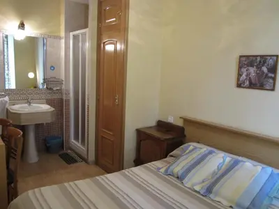 Cama o camas de una habitación en Pensión Mollo