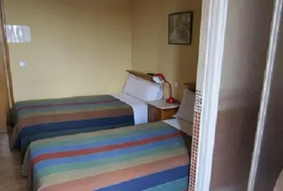 Cama o camas de una habitación en Pensión Mollo