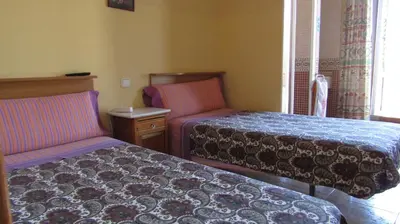 Cama o camas de una habitación en Pensión Mollo