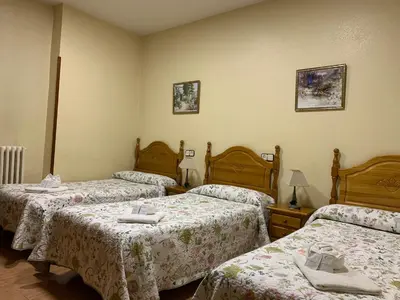 Cama o camas de una habitación en Hostal Internacional