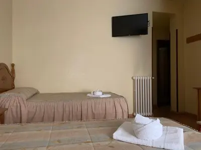 Cama o camas de una habitación en Hostal Internacional
