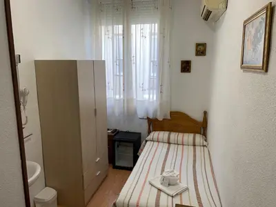 Cama o camas de una habitación en Hostal Internacional