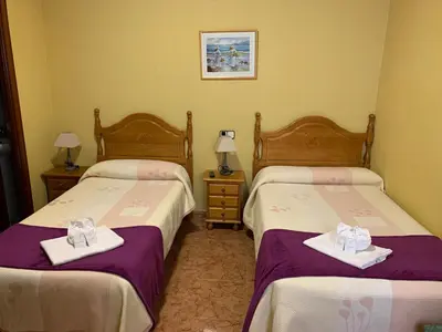 Cama o camas de una habitación en Hostal Internacional