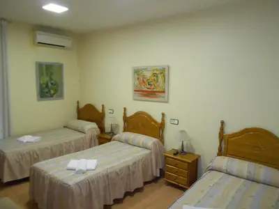 Cama o camas de una habitación en Hostal Internacional