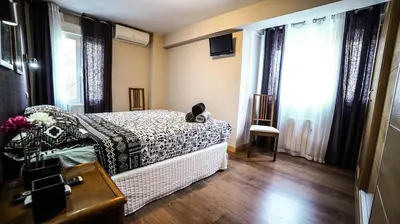 Cama o camas de una habitación en Apartments Madrid Eliptica