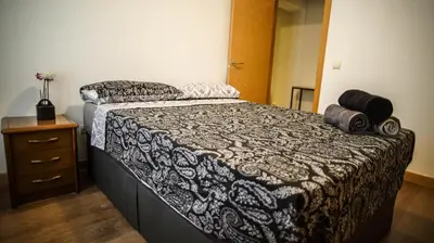 Cama o camas de una habitación en Apartments Madrid Eliptica