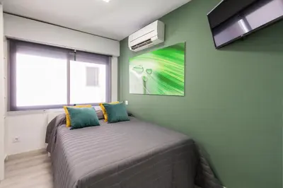 Cama o camas de una habitación en Callao Apartment