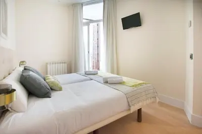 Cama o camas de una habitación en Bright Luxury apt. Puerta del Sol - Madrid