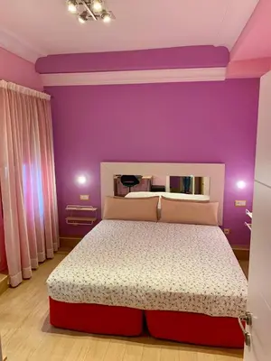 Cama o camas de una habitación en Hostal Arco Iris