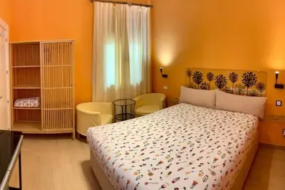 Cama o camas de una habitación en Hostal Arco Iris