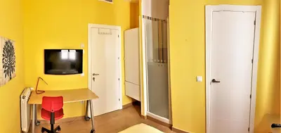 Una televisión o centro de entretenimiento en Hostal Arco Iris
