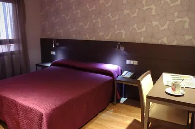 Cama o camas de una habitación en Hostal 4C Cuatro Caminos