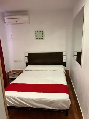 Cama o camas de una habitación en Hostal Las Vegas
