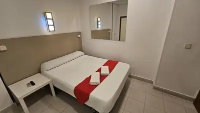 Cama o camas de una habitación en Hostal Las Vegas