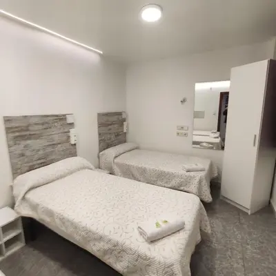 Cama o camas de una habitación en Hostal Las Vegas