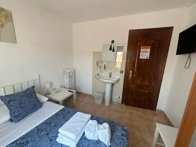 Cama o camas de una habitación en Hostal Arrate