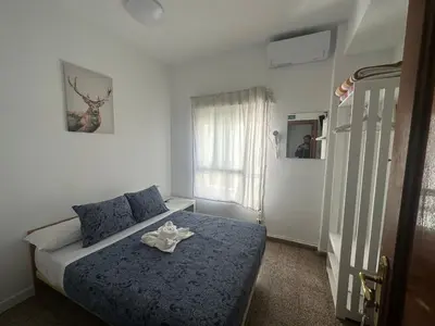 Cama o camas de una habitación en Hostal Arrate