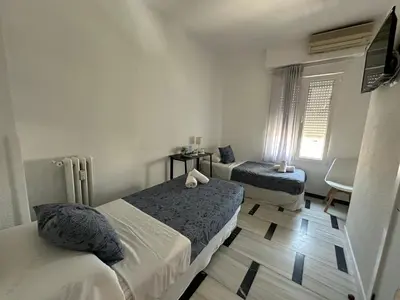 Cama o camas de una habitación en Hostal Arrate