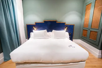 Cama o camas de una habitación en Soho Boutique Congreso