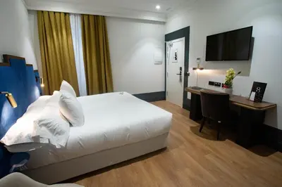 Cama o camas de una habitación en Soho Boutique Congreso