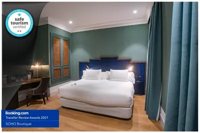 Cama o camas de una habitación en Soho Boutique Congreso