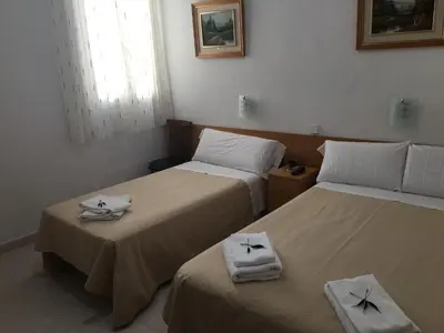 Cama o camas de una habitación en Hostal R. Lido