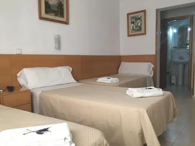 Cama o camas de una habitación en Hostal R. Lido