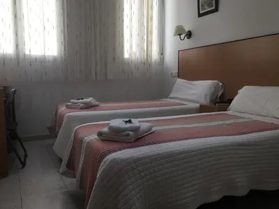 Cama o camas de una habitación en Hostal R. Lido