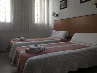 Cama o camas de una habitación en Hostal R. Lido