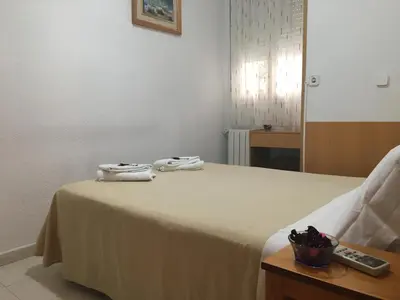 Cama o camas de una habitación en Hostal R. Lido