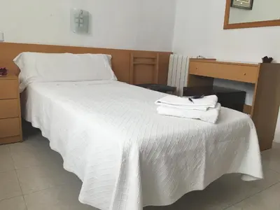Cama o camas de una habitación en Hostal R. Lido