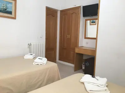 Cama o camas de una habitación en Hostal R. Lido
