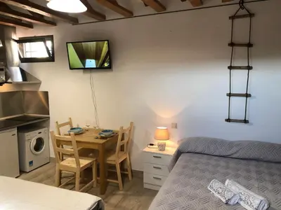Cama o camas de una habitación en Gran Vía apartamentos de temporada