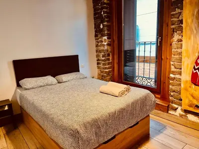 Cama o camas de una habitación en Gran Vía apartamentos de temporada