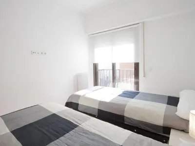 Cama o camas de una habitación en Piso parking en el madrid más castizo