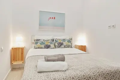 Cama o camas de una habitación en LEEWAYS APARTMENT in DIVINO PASTOR