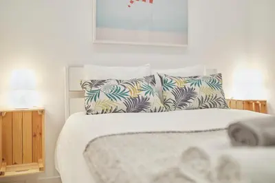Cama o camas de una habitación en LEEWAYS APARTMENT in DIVINO PASTOR