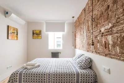 Cama o camas de una habitación en Impressive Apartment in Madrid Center by Batuecas