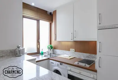 Una cocina o zona de cocina en Argüelles - Apartamento acogedor para 4, AC