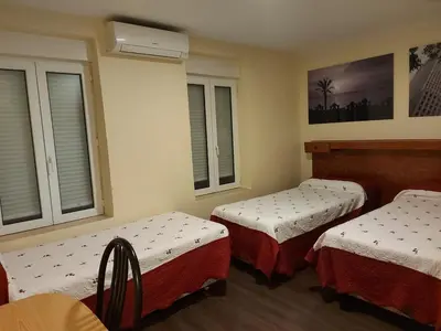 Cama o camas de una habitación en Hostal Moncloa