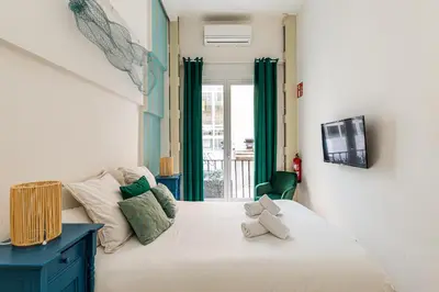 Cama o camas de una habitación en Waou Gran Via III - Alquiler Corta Duración