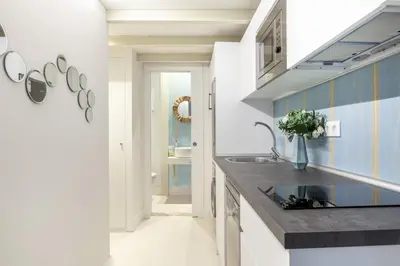Una cocina o zona de cocina en Waou Gran Via III - Alquiler Corta Duración