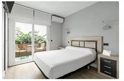 Cama o camas de una habitación en Hostal Los Ángeles